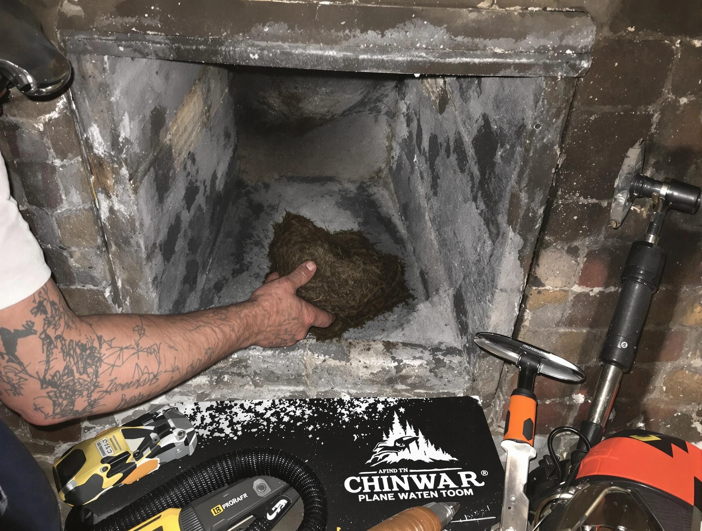 South Salt Lake Chimney Sweep safely removing debris and screening chimney in South Salt Lake, UT